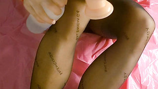 POV. Horny slut in luxurious black dress and pantyhose gives you a glamorous footjob, and orgasms with cock vibrator and dildo