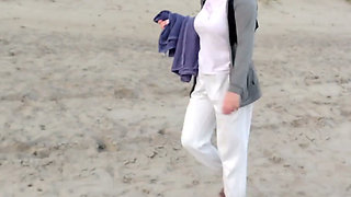 POV. You Watch as a Busty Model, of Your Presence, Strips Naked on the Beach, Bathes, and Plays in the Sand.
