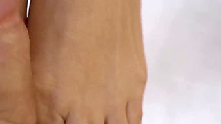 Blonde MILF in Stockings Gives Erotic Foot Fuck
