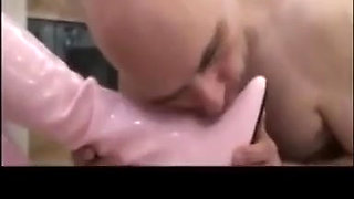 Bootslave must clean black and pink boots of the ladies!