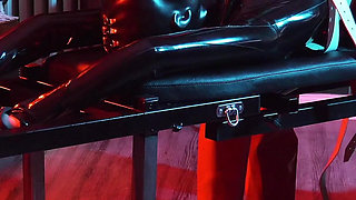 Heavy rubber masked latexgirl stretched and tickled