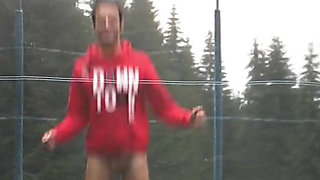 Teen Shows His Big Cock for Fun on a Trampoline at the Camp