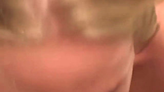 Horny Blonde Sucks Dildo in Bathroom