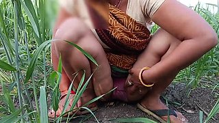 Desi 18-year-old married bhabhi fingers her wet pussy in the field, then brother fucks her tight butt outdoors
