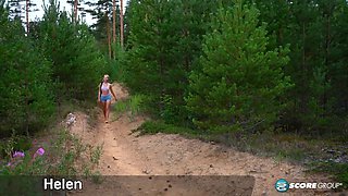 Horny Helen gets naked in the woods and fingers her bald pussy furiously.
