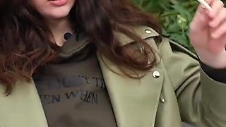 Young Brunette Is Taking an Unhurried Stroll with Allwhite 120mm Cigarette