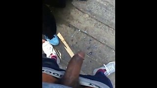 Black amateurs stroke big cocks outdoors