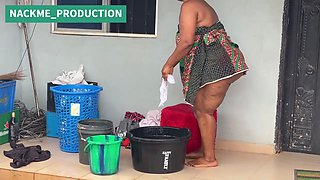 African Mama Multitasks on a Sunday Morning