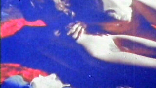 Blue-tinted Vintage Loop Shows Retro Couple in Raw 70s Action
