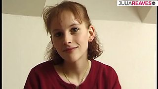 Skinny redhead strips on bed and fingers herself with moaning