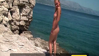 970 Model Coxy Posing in a Swimsuit on a Cliff