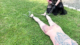 Double Female Domination with Already Heavy Bruised Slaven Who Receives More Corporal Punishment Outside in the Sun.
