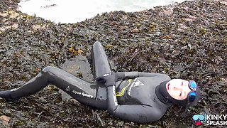 Rubbery Beach Encounter: Lucy's Neoprene Pussy Play with Stranger
