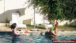 A strip down game outdoors in the swimming pool