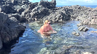 Nudist Girl Swimming Naked in the Natural Pool Outdoor