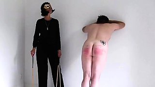 Pitiful slave spanked hard by merciless MILF mistress