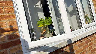 window peeping view of horny housewife