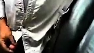 Bearded daddy strokes his cock by his truck outdoors.