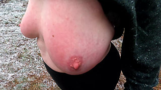Slapping her tits while hiking through the snow