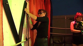 Mature Redhead Squirts Wildly in Intense Group Domination Session