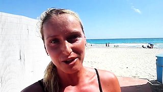 Outdoor solo masturbation scene with curly blonde